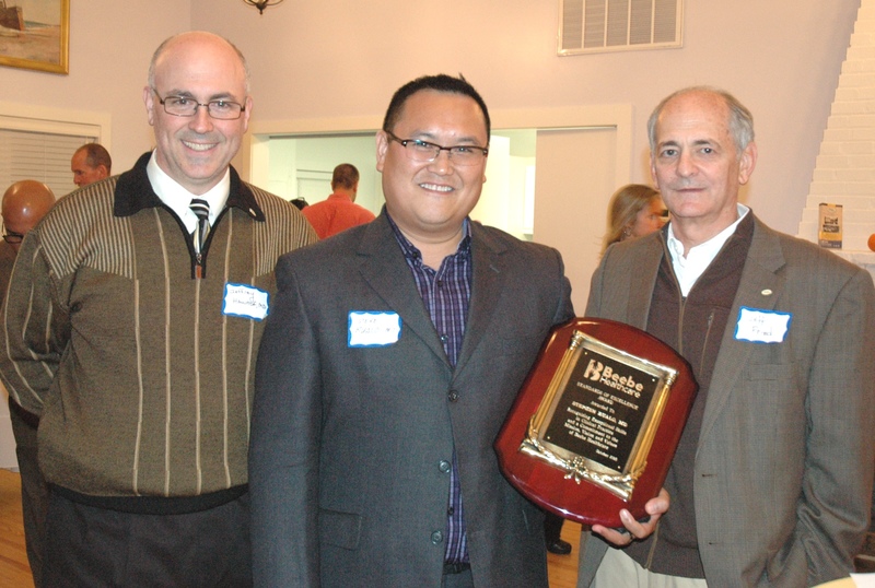 Beebe Healthcare and Beebe Medical Foundation have recognized Stephen Rualo, MD, for his commitment to clinical excellence and for his contributions to healthcare by honoring him with the organization’s Standards of Excellence Award. Pictured here, left to right, are: Jeffrey E. Hawtof, MD, FAAFP, Vice President of Medical Operations and Informatics at Beebe Healthcare; Dr. Rualo; and Jeffrey M. Fried, FACHE, President and CEO of Beebe Healthcare.